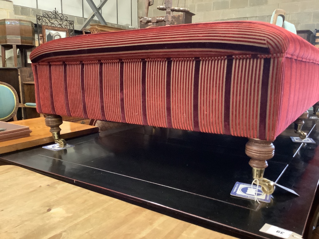 A large Victorian style rectangular upholstered footstool on six turned feet, length 156cm, depth 90cm, height 43cm